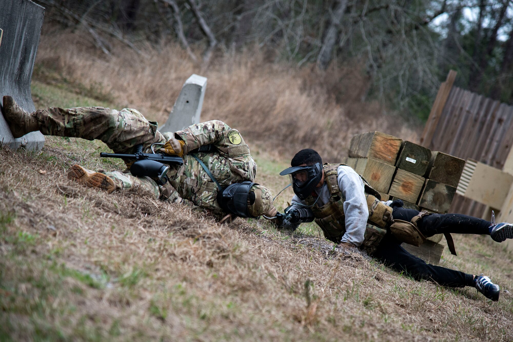 Airman 1st Class Andruw Reyes, right, 23d Maintenance Squadron nondestructive inspection technician, lunges toward Staff Sgt. Michael Triana, 347th Operations Support Squadron, in a high threat evasion scenario during a Tactical Combat Casualty Care course, Feb. 14, 2018, at Moody Air Force Base, Ga. The training is designed to teach Airmen how to apply critical life-saving skills while engaged in a combat environment. (U.S. Air Force photo by Airman 1st Class Erick Requadt)
