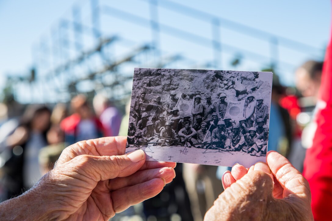 Retired U.S. Marine Corps Sergeant Edward Mix, a 5th Marine Division Iwo Jima Veteran, shares a photograph taken during the Battle of Iwo Jima at a tour of Marine Corps Base Camp Pendleton in commemoration of the 73rd Anniversary of the Battle of Iwo Jima, Feb 15, 2018. Iwo Jima was a major World War II battle in which the United States Marine Corps landed on and eventually captured the island of Iwo Jima from the Japanese Imperial Army. Veterans of the battle and their family members were invited to Camp Pendleton for a tour which included a special reaction team static display, Meal Ready to Eat sampling, and a tour of the Assault Craft Unit-5. (U.S. Marine Corps Photo by Pfc. Kerstin Roberts)