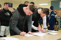 Participants register for the St. Valentine’s Day 5k/10k Feb. 14, 2018, at Dover Air Force Base, Del. The event was sponsored by the base fitness center. (U.S. Air Force photo by Mauricio Campino)
