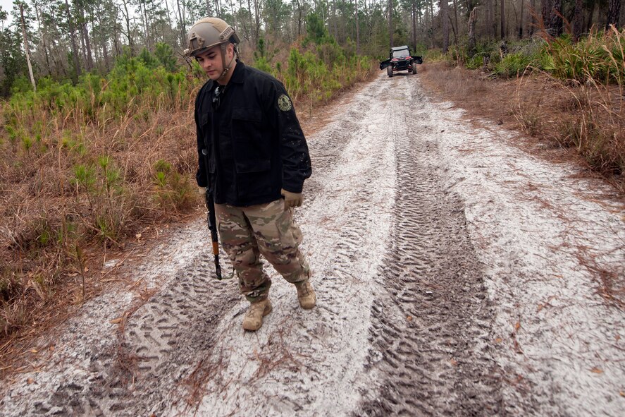 Staff Sgt. Michael Triana, 347th Operations Support Squadron independent duty mechanical technician, inspects the ground for footprints during combat survival training (CST), Feb. 13, 2018, at Moody Air Force base, Ga. CST prepares Airmen to avoid an enemy in the case that their aircraft were to crash in hostile territory.
(U.S. Air Force photo by Airman Eugene Oliver)