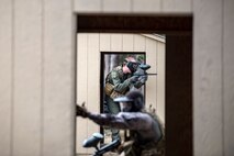 Capt. John, 71st Rescue Squadron HC-130J Combat King II pilot, top, shoots cover-fire for Airman 1st Class Kevin Sherriffe, 23d Medical Operations Squadron aerospace medical technician, Feb. 14, 2018, at Moody Air Force Base, Ga.  Airmen participated in a Tactical Combat Casualty Care (TCCC) course to better prepare themselves to combat an enemy attack while still being able to apply medical care under enemy fire.
(U.S. Air Force photo by Airman Eugene Oliver)
