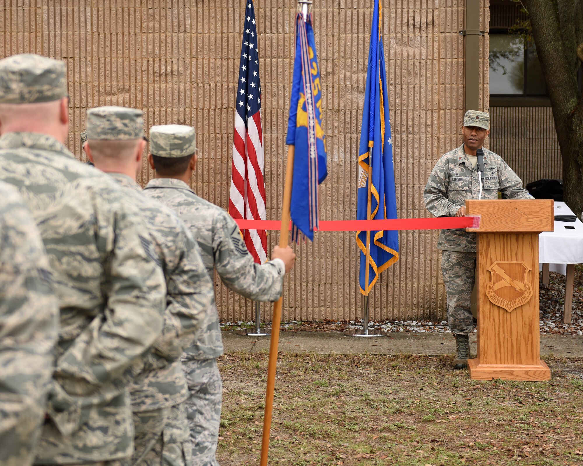 U.S. Air Force Maj. James Johnson, 325th Communications Squadron commander (right), praises the 325th CS Airmen for a job well done during a ribbon cutting ceremony at Tyndall Air Force Base, Fla., Feb. 15, 2018. The ceremony marks the transition from a pathfinder unit within the cyber squadron initiative to the Air Force’s first fully operational mission defense team. (U.S. Air Force photo by Airman 1st Class Isaiah J. Soliz/Released)