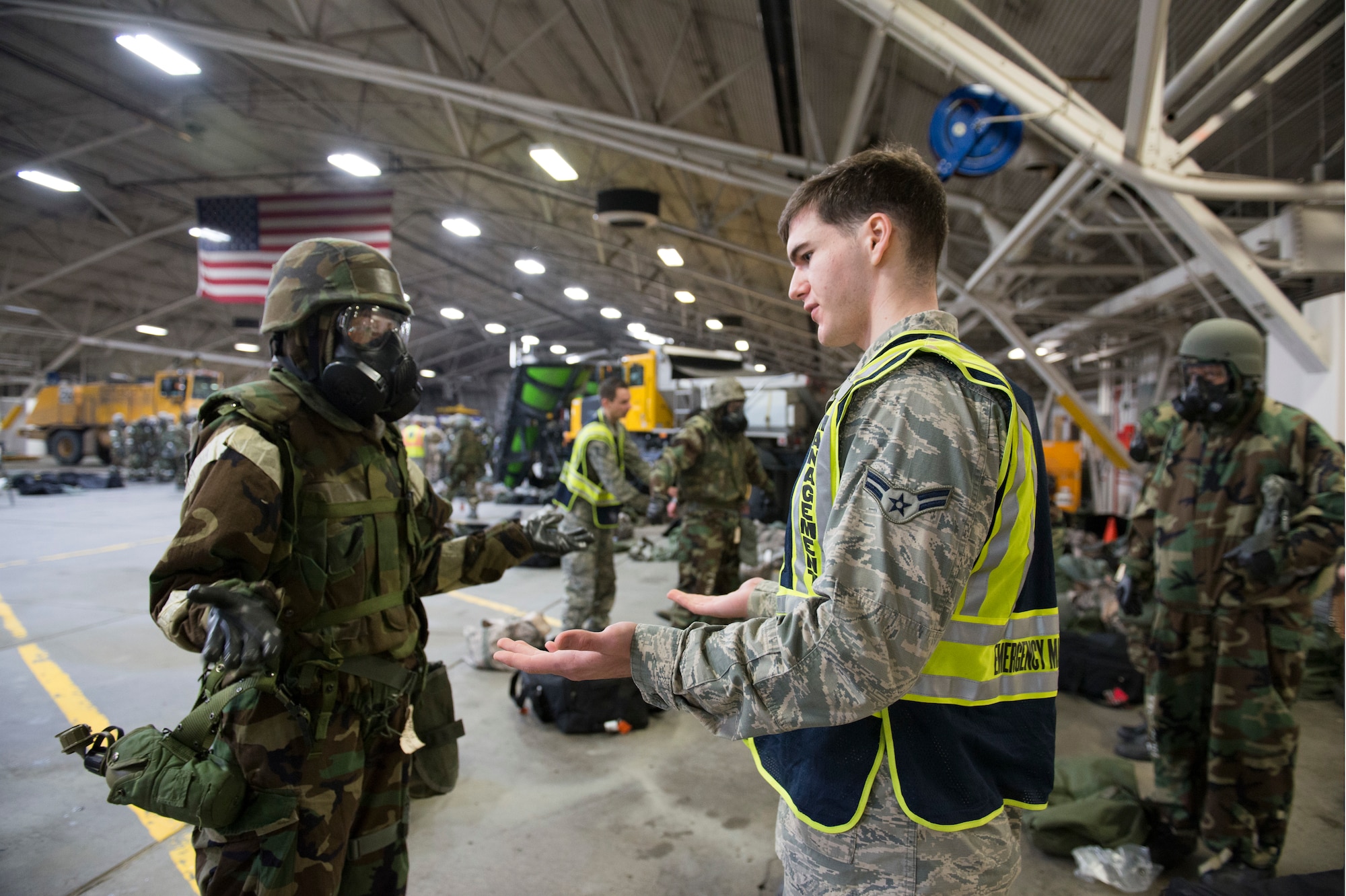 Airman 1st Class Paul Seamen, with the 773d Civil Engineer Squadron Emergency Management team, evaluates Senior Airman Stephanie Sochin, with the 773d CES Operations Management, mission-oriented protective posture level 4 gear Feb. 8, 2018, at Joint Base Elmendorf-Richardson, Alaska. Chemical, biological, radiological and nuclear defense training was incorporated into the 673d Civil Engineer Group, Prime Base Engineer Emergency Force monthly training.