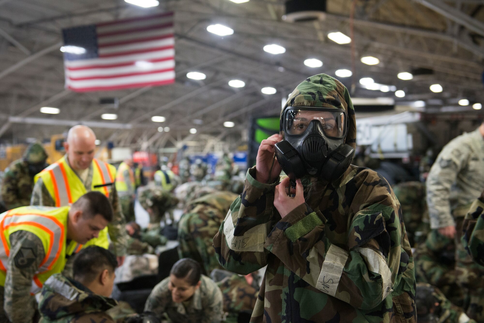 Senior Airman Stephanie Sochin, with the 773d Civil Engineer Squadron Operations Management, checks the seal on her protective mask during a chemical, biological, radiological and nuclear defense training Feb. 8, 2018, at Joint Base Elmendorf-Richardson, Alaska. CBRN defense training was incorporated into the 673d Civil Engineer Group, Prime Base Engineer Emergency Force monthly training to maintain a readiness posture that enables them to execute a variety of operations in austere environments at a moment’s notice.