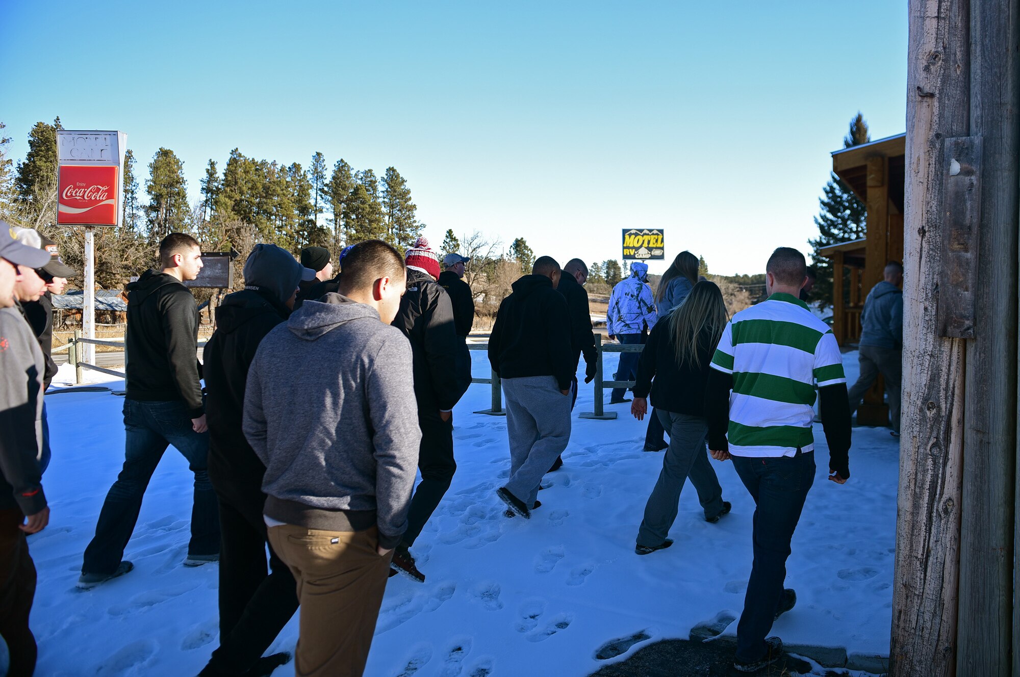 Airmen from Ellsworth Air Force Base, S.D., make their way to a local family’s house to help pack their belongings near Rockerville on Feb. 17, 2018. The family needed help with an unforeseen last-minute move, and Airmen from various squadrons came to help.  (U.S. Air Force photo by Senior Airman James L. Miller)