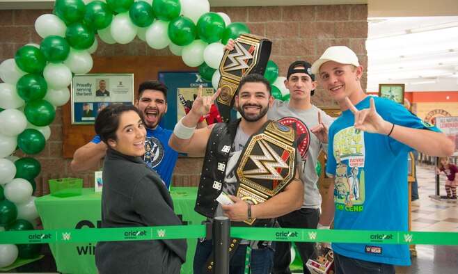 Members from Team Luke pose for a photo before a meet-and-greet event with AJ Styles, World Wrestling Entertainment professional athlete, at Luke Air Force Base, Ariz., Feb. 20, 2018. Airmen and other visitors with base access had the opportunity to take photos, receive autographs and interact with Styles during the event. (U.S. Air Force photo/Airman 1st Class Caleb Worpel)