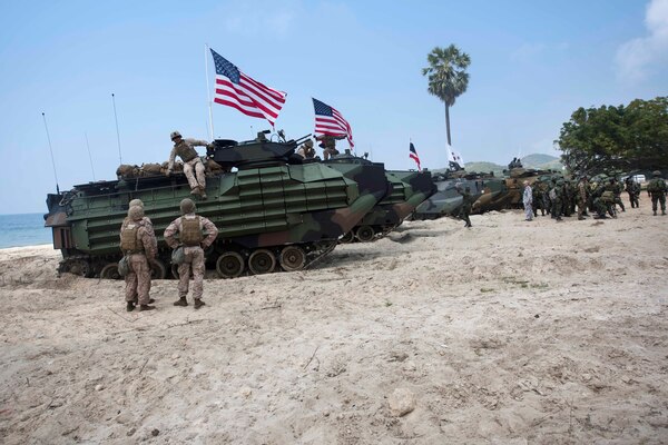 U.S., South Korean and Thai Marines position their assault amphibious vehicles after conducting an amphibious assault.