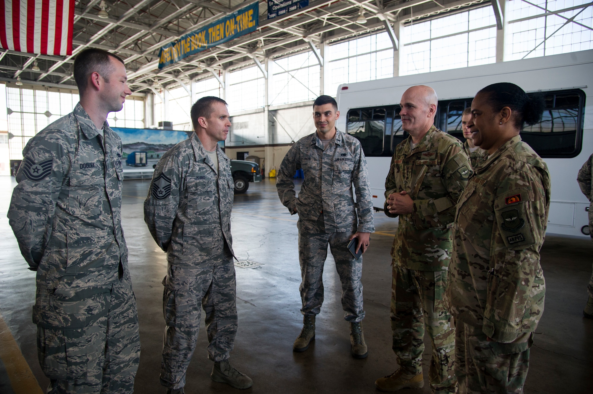 Tech. Sgt. Joseph Dooley, Senior Master Sgt. Shawn Kubo, and 1st Lt. Justin Rees, assigned to the 735th Air Mobility Squadron, brief Gen. Carlton D. Everhart, Air Mobility Command commander, and Chief Master Sgt. Shelina Frey, Air Mobility Command command chief, on infrastructure planning in Hanger 9 at Joint Base Pearl Harbor-Hickam, Feb. 11, 2018. Everhart visited the Airmen of the 515th Air Mobility Operations Wing Feb. 6-12 to better understand how the command can support enroute mobility operations and enable global reach for the joint warfighter. The 515th AMOW, headquartered at Joint Base Pearl Harbor-Hickam, Hawaii, oversees Air Mobility Commands enroute maintenance, command and control and aerial port support operations at 26 locations across 100 million square miles in the Pacific. (U.S. Air Force photo by Tech. Sgt. Heather Redman)