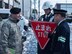 U.S. Air Force Maj. Patrick C. Gordon, left, the 35th Security Forces Squadron commander, a Misawa City Police officer, center, and Nobuhiro Izumida, right, the Misawa City Police Station Chief, engage in conversation prior to installing the first bi-lingual stop sign at an intersection in Misawa City, Japan, Feb. 15, 2018. The bi-lingual stop signs may assist guests traveling here for the 2020 Olympics in Tokyo. (U.S. Air Force photo by Airman 1st Class Collette Brooks)