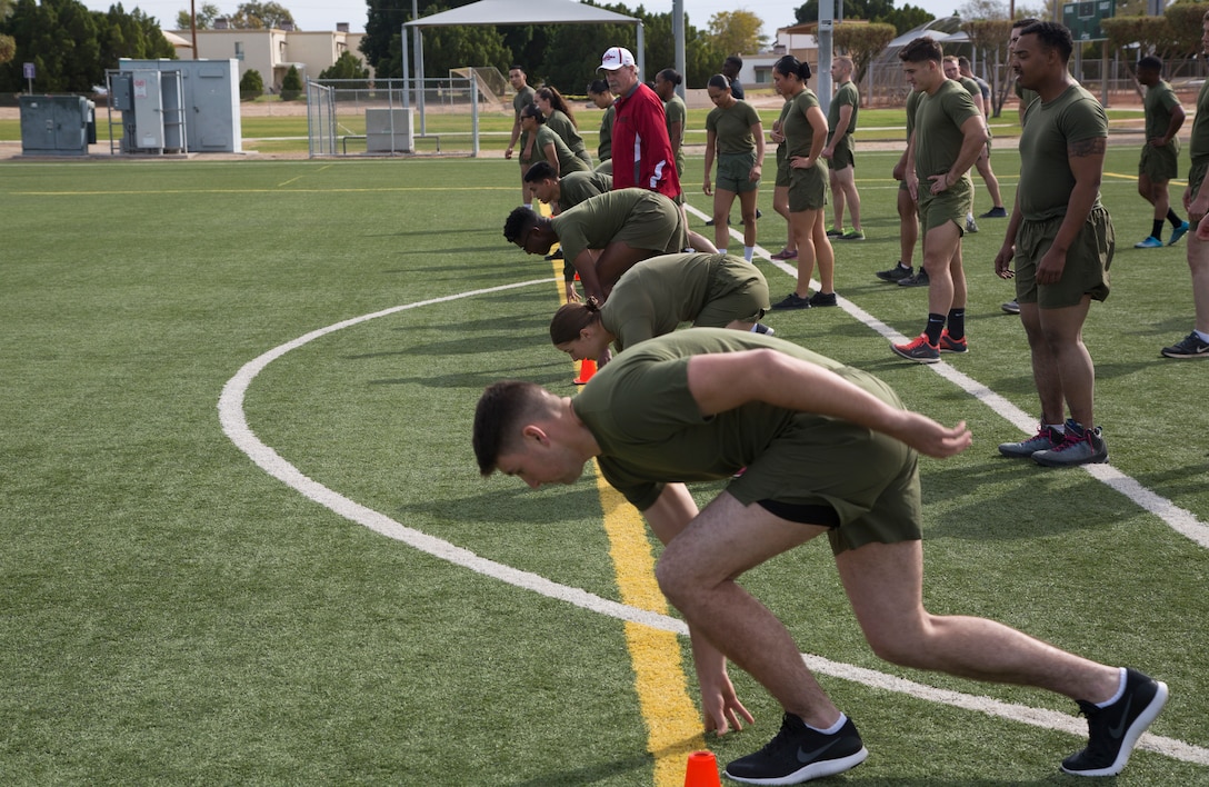 U. S. Marines Assigned to Marine Corps Air Station Yuma, Airz., participate in the 3rd annual Marine Corps Air Staion Yuma's Fastest Man-Women 100 meter sprint at the station's Ramada Field, Feb. 16, 2018.  The Fastest Man, Fastest Women event is open to Marines from different units on station and is held to boost morale and unit cohesion among peers, subordinants, and superiois