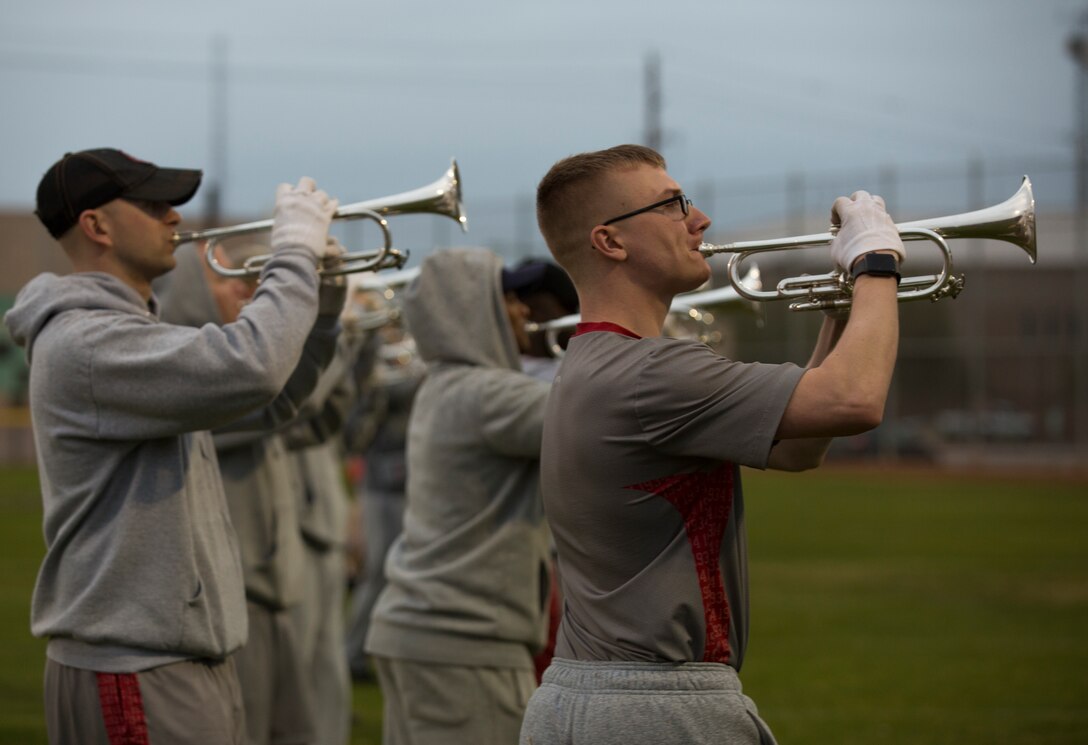U.S. Marines with "The Commandants Own" U.S. Marine Corps Drum & Bugle Corps conduct practice at Marine Corps Air Station Yuma, Ariz., Feb. 13, 2018 to prepare for their West Coast tour. The Marine Corps Drum & Bugle Corps are apart of The Battle Color Detachment along with the Marine Corps Silent Drill Platoon and The Official Color Guard of the Marine Corps. (U.S. Marine Corps photo by Lance Cpl. Sabrina Candiaflores)