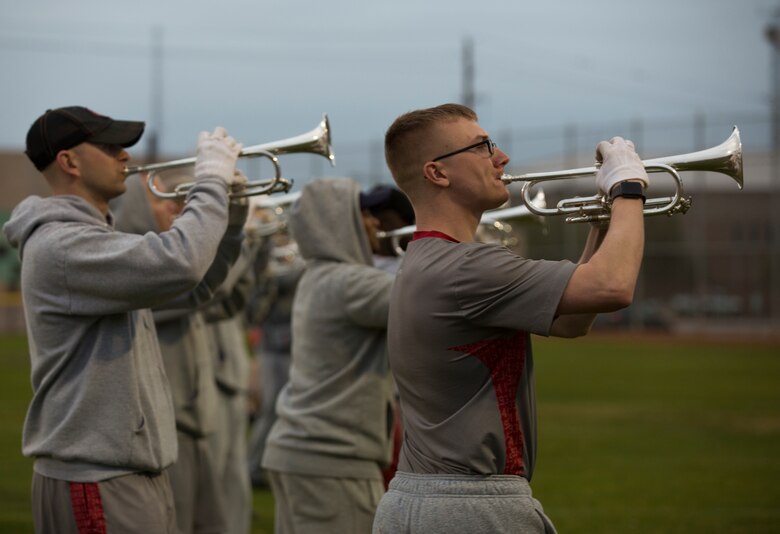 U.S. Marines with "The Commandants Own" U.S. Marine Corps Drum & Bugle Corps conduct practice at Marine Corps Air Station Yuma, Ariz., Feb. 13, 2018 to prepare for their West Coast tour. The Marine Corps Drum & Bugle Corps are apart of The Battle Color Detachment along with the Marine Corps Silent Drill Platoon and The Official Color Guard of the Marine Corps. (U.S. Marine Corps photo by Lance Cpl. Sabrina Candiaflores)