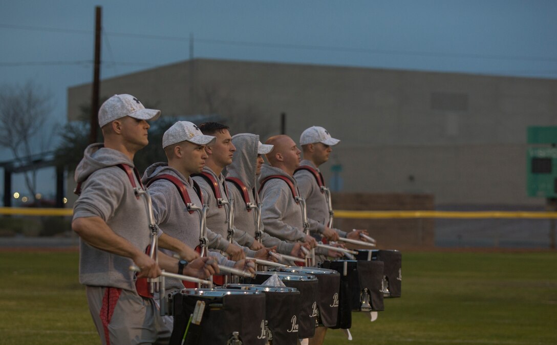 U.S. Marines with "The Commandants Own" U.S. Marine Corps Drum & Bugle Corps conduct practice at Marine Corps Air Station Yuma, Ariz., Feb. 13, 2018 to prepare for their West Coast tour. The Marine Corps Drum & Bugle Corps are apart of The Battle Color Detachment along with the Marine Corps Silent Drill Platoon and The Official Color Guard of the Marine Corps. (U.S. Marine Corps photo by Lance Cpl. Sabrina Candiaflores)