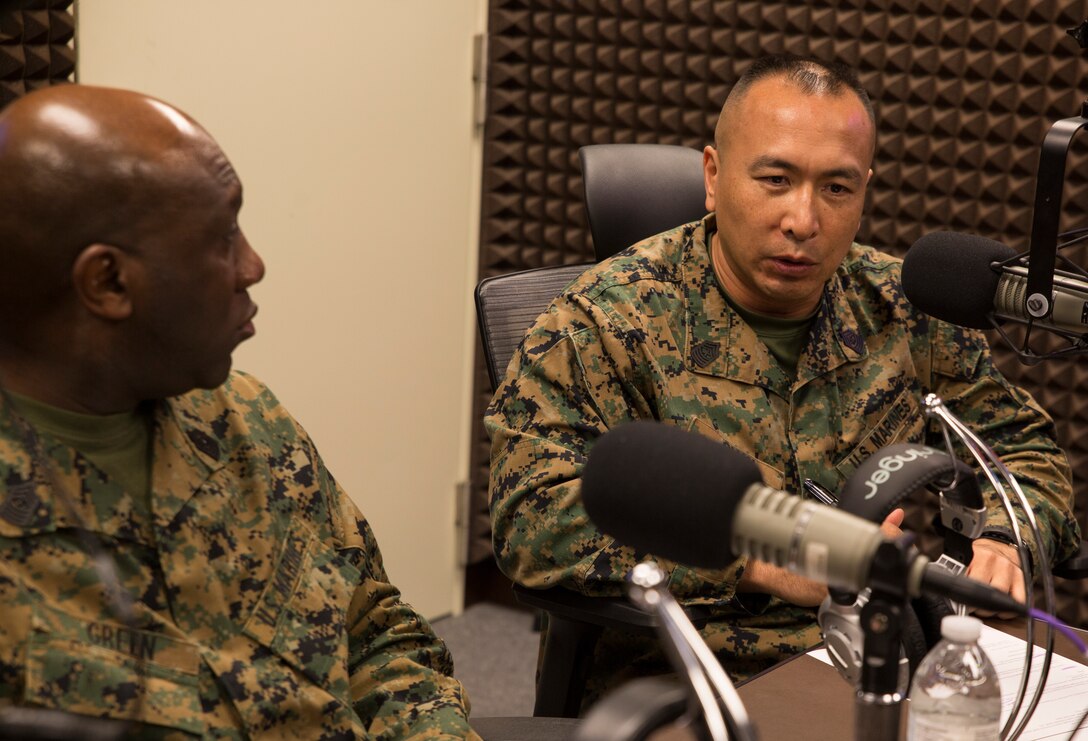 Marine Corps Installations Pacific sergeant major, Sgt. Maj. Peter Siaw, gives a closing comment during a radio show at American Forces Network, Okinawa, Japan, Feb. 21, 2018. Siaw, Sgt. Maj. Ronald Green, the sergeant major of the Marine Corps, and Sgt. Maj. Mario Marquez, the III Marine Expeditionary Force sergeant major, talked to the AFN Pacific audience about changes in the Marine Corps. (U.S. Marine Corps photo by Pfc. Hannah Hall)