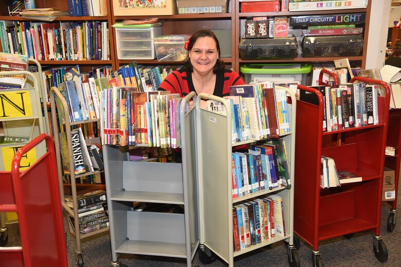 PETERSON AIR FORCE BASE, Colo. – Rebecca Perkins, 21st Force Support Squadron Library supervisory librarian, works to replace outdated books at the base library on Peterson Air Force Base, Colorado, Feb. 14, 2018. Each book must be properly catalogued to provide easy access for customers. (U.S. Air Force photo by Robb Lingley)