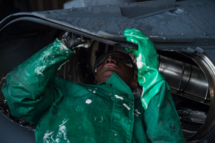 Airman 1st Class Marlon Natty, 41st Helicopter Maintenance Unit crew chief, washes an HH-60G Pave Hawk, Feb. 20, 2018, at Moody Air Force Base, Ga. Airmen are required to wash the helicopters every 180 days to control corrosion caused by oil, dirt and grime. Washing paired with mechanical and electrical maintenance help Airmen ensure the Pave Hawks are ready at a moment’s notice. (U.S. Air Force photo by Senior Airman Janiqua P. Robinson)