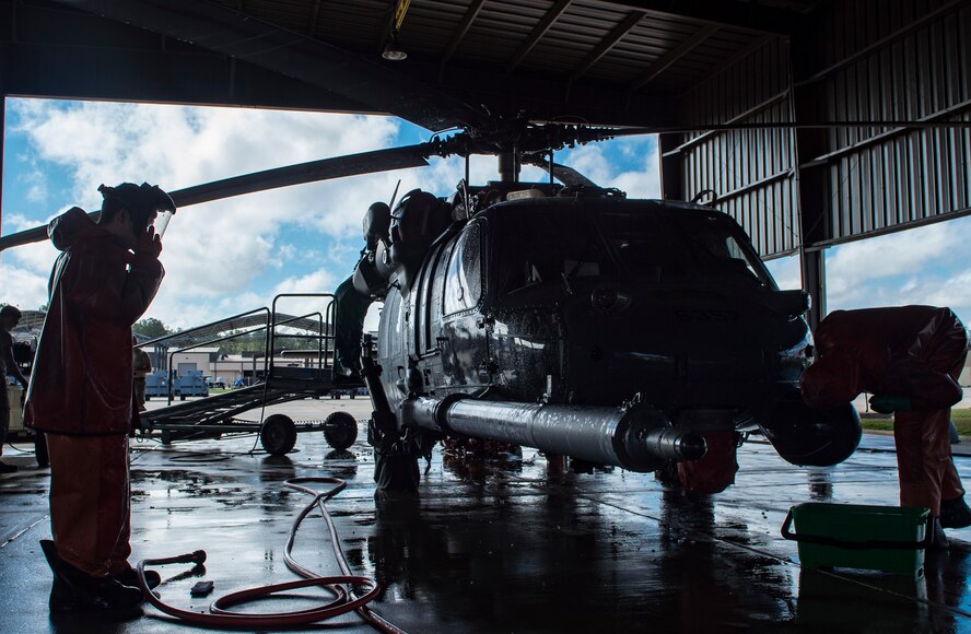 Airmen from the 41st Helicopter Maintenance Unit wash an HH-60G Pave Hawk, Feb. 20, 2018, at Moody Air Force Base, Ga. Airmen are required to wash the helicopters every 180 days to control corrosion caused by oil, dirt and grime. Washing paired with mechanical and electrical maintenance help Airmen ensure the Pave Hawks are ready at a moment’s notice. (U.S. Air Force photo by Senior Airman Janiqua P. Robinson)