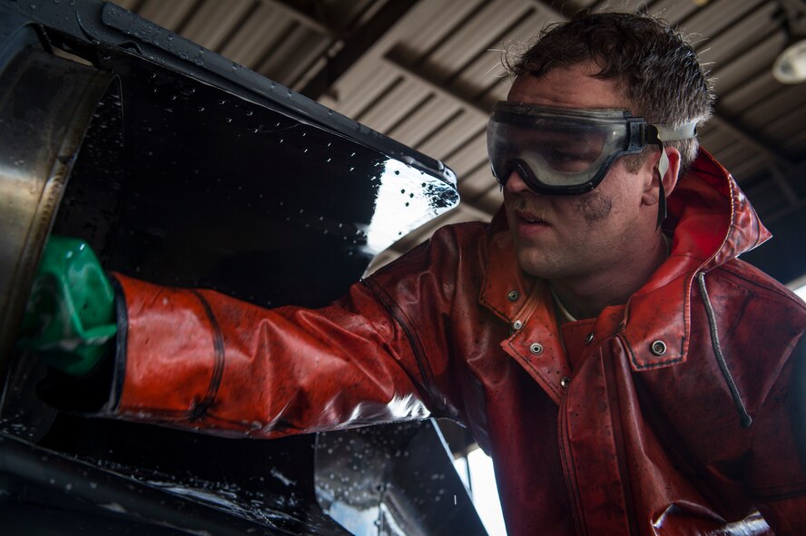 Senior Airman Zachary Oswald, 41st Helicopter Maintenance Unit crew chief, scrubs an HH-60G Pave Hawk, Feb. 20, 2018, at Moody Air Force Base, Ga. Airmen are required to wash the helicopters every 180 days to control corrosion caused by oil, dirt and grime. Washing paired with mechanical and electrical maintenance help Airmen ensure the Pave Hawks are readyat a moment’s notice. (U.S. Air Force photo by Senior Airman Janiqua P. Robinson)