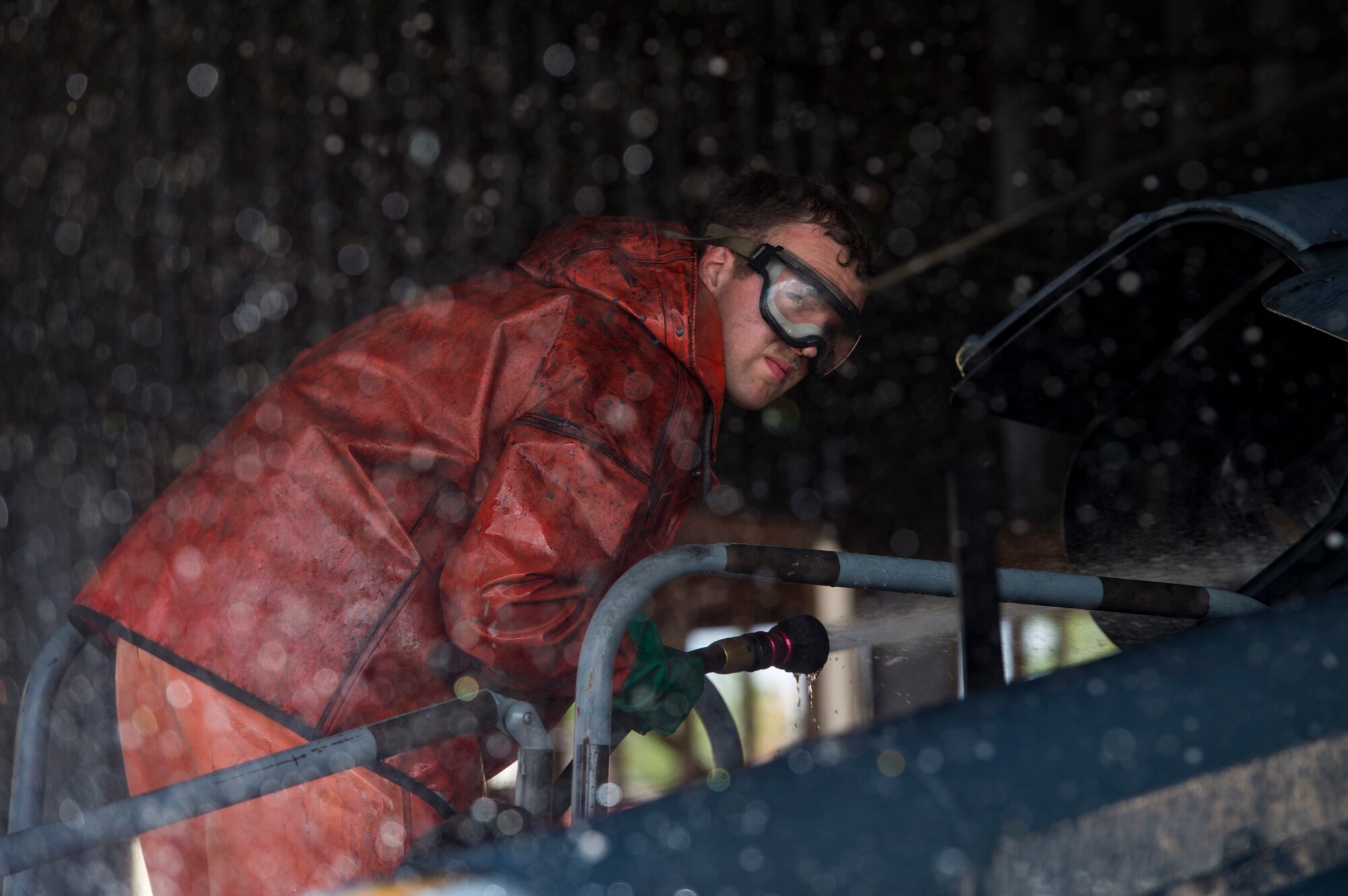 Senior Airman Zachary Oswald, 41st Helicopter Maintenance Unit crew chief, sprays an HH-60G Pave Hawk, Feb. 20, 2018, at Moody Air Force Base, Ga. Airmen are required to wash the helicopters every 180 days to control corrosion caused by oil, dirt and grime. Washing paired with mechanical and electrical maintenance help Airmen ensure the Pave Hawks are ready at a moment’s notice. (U.S. Air Force photo by Senior Airman Janiqua P. Robinson)