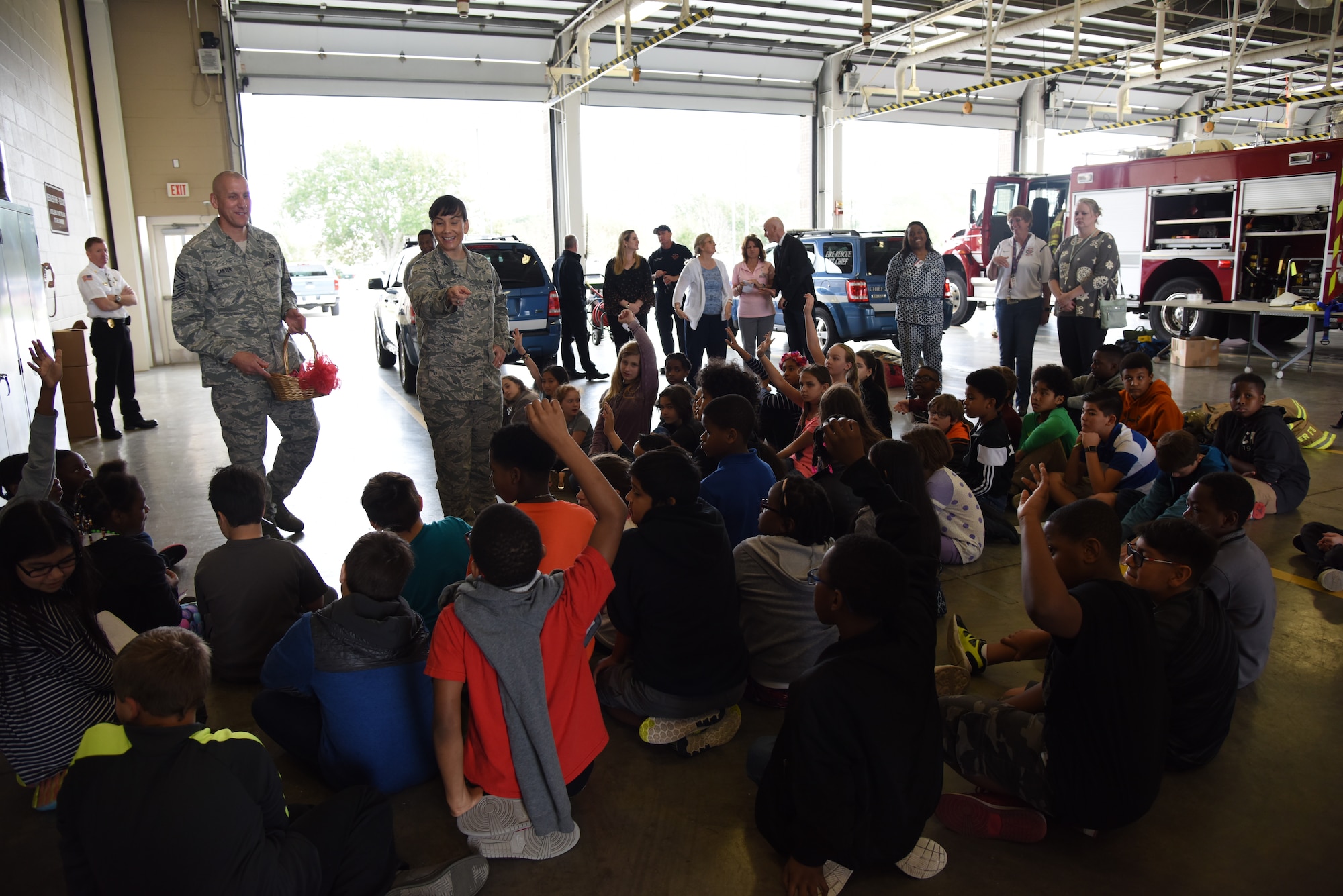 Col. Debra Lovette, 81st Training Wing commander, answers questions during Biloxi Career Exploration Day at the fire department Feb. 14, 2018, on Keesler Air Force Base, Mississippi. The school-aged children toured the fire department, 334th Training Squadron, 335th TRS and the Trainer Development Center. (U.S. Air Force photo by Kemberly Groue)