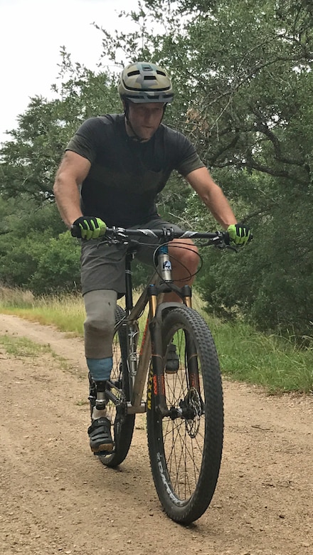 Chief Master Sgt. Chad Caden, the chief enlisted manager with the 633rd Civil Engineer Squadron at Joint Base Langley-Eustis, takes his first mountain bike ride with his prosthetic leg in Austin, Texas. (Courtesy photo)
