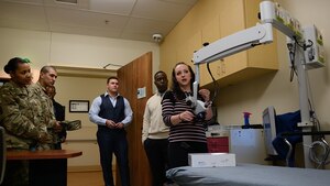 Christina Archer, Riverside Hospital forensic nurse examiner, demonstrates the use of a forensic microscope to Victim Advocates and Sexual Assault Response Coordinators during a Resource Ride in Newport News, Virginia, Feb. 15, 2018.