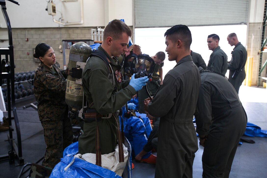 Marines with Aircraft Rescue and Firefighting (ARFF) prepare to mitigate simulated hazardous materials (HAZMAT) at Marine Corps Air Station Miramar, Calif., Feb. 15. More than 20 Marines with ARFF trained to respond to HAZMAT exposure Feb. 5 through Feb. 20, and completed classroom education and practical application scenarios. (U.S. Marine Corps photo by Cpl. Daniel Auvert/ Released)
