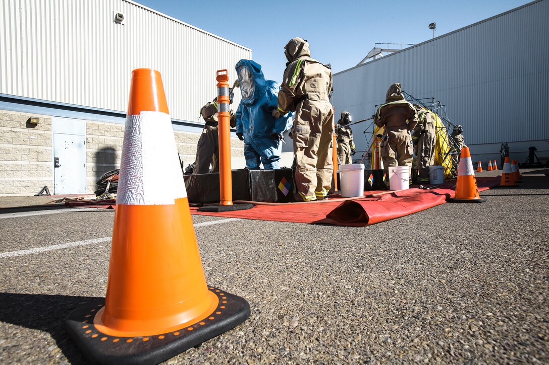 Marines with Aircraft Rescue and Firefighting (ARFF) go through a decontamination station after completing a simulated hazardous material (HAZMAT) exercise at MCAS Miramar, Calif., Feb. 15. More than 20 Marines with ARFF trained to respond to HAZMAT exposure Feb. 5 through Feb. 20, and completed classroom education and practical application scenarios. (U.S. Marine Corps photo by Cpl. Jake McClung/Released)