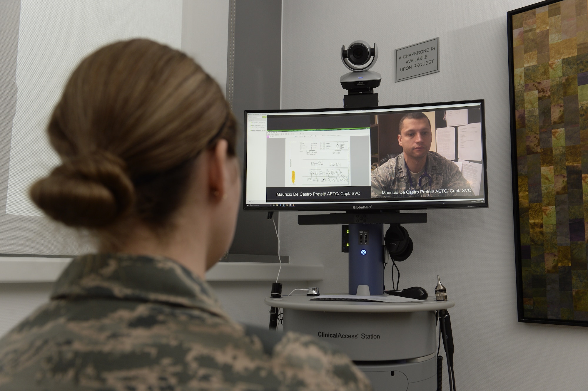 Senior Airman Kimberly Deveau (left) at Spangdahlem Air Base, Germany consults with geneticist, Capt. (Dr.) Mauricio De Castro, staff medical geneticist at Keesler Air Force Base, Miss., using the Clinical Access Station, Feb. 1, 2018. The tele-genetics pilot program connects patients directly to specialized genetic counselors and geneticists from other locations. (U.S. Air Force photo by Staff Sgt. Jonathan Snyder)