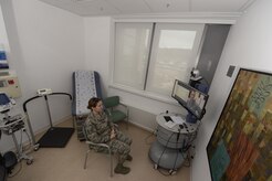 Senior Airman Kimberly Deveau sits in a private room at Spangdahlem Air Base, Germany as she receives specialty genetic counseling via a video teleconference from Capt. (Dr.) Mauricio De Castro, staff medical geneticist at Keesler Air Force Base, Miss., Feb. 1, 2018. The tele-genetics pilot program connects patients directly to specialized genetic counselors and geneticists from other locations. (U.S. Air Force photo by Staff Sgt. Jonathan Snyder)