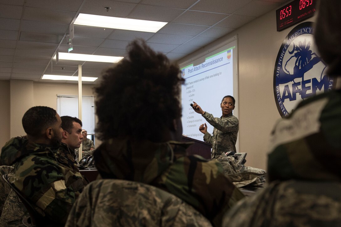U.S. Air Force Airman 1st Class Kailee Johnson, 20th Civil Engineer Squadron emergency management apprentice, teaches a chemical, biological, radiological and nuclear defense class at Shaw Air Force Base, S.C., Feb. 15, 2018.
