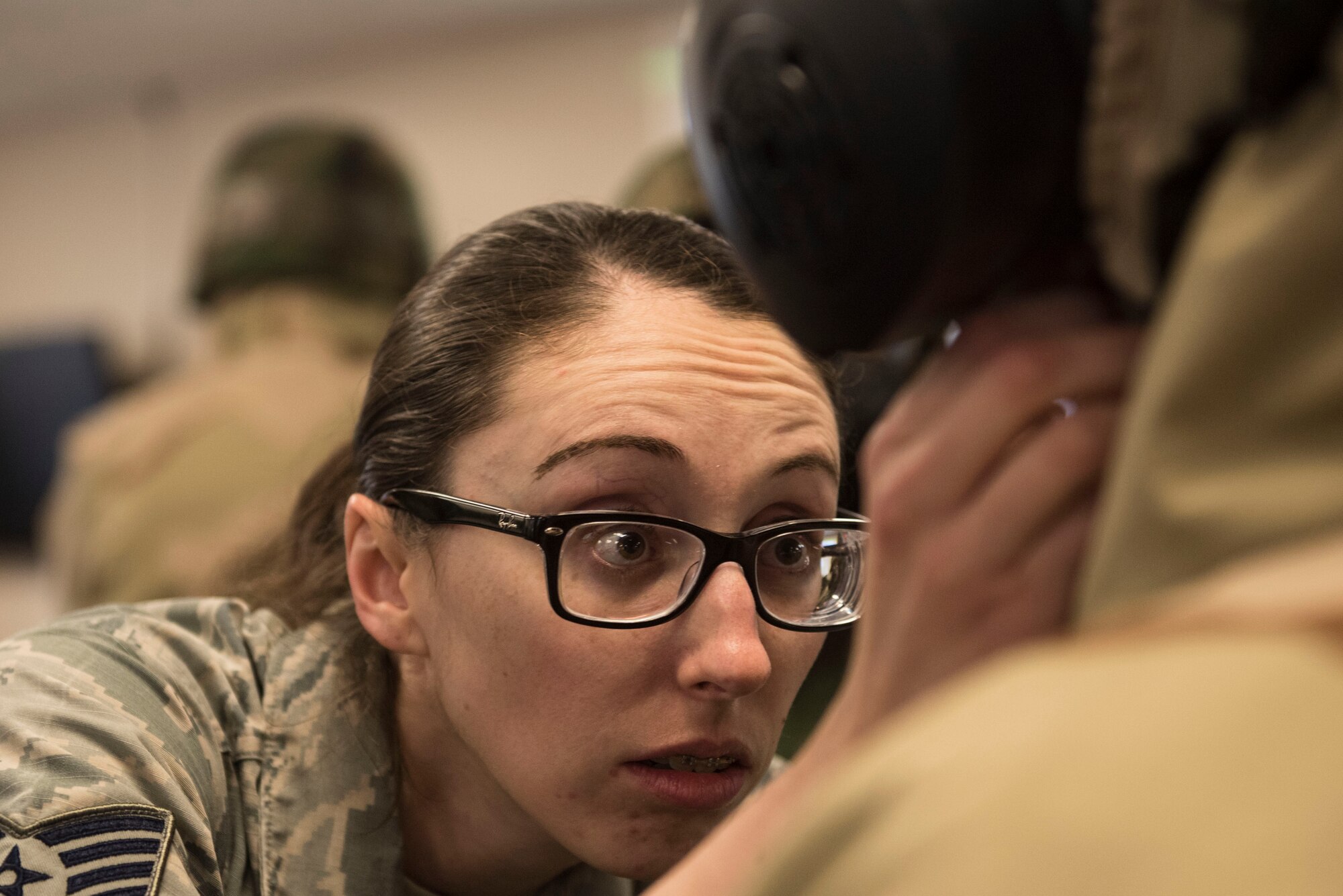 A U.S. Air Force emergency management technician checks a student’s mission-oriented protective posture gear at Shaw Air Force Base, S.C., Feb. 15, 2018.