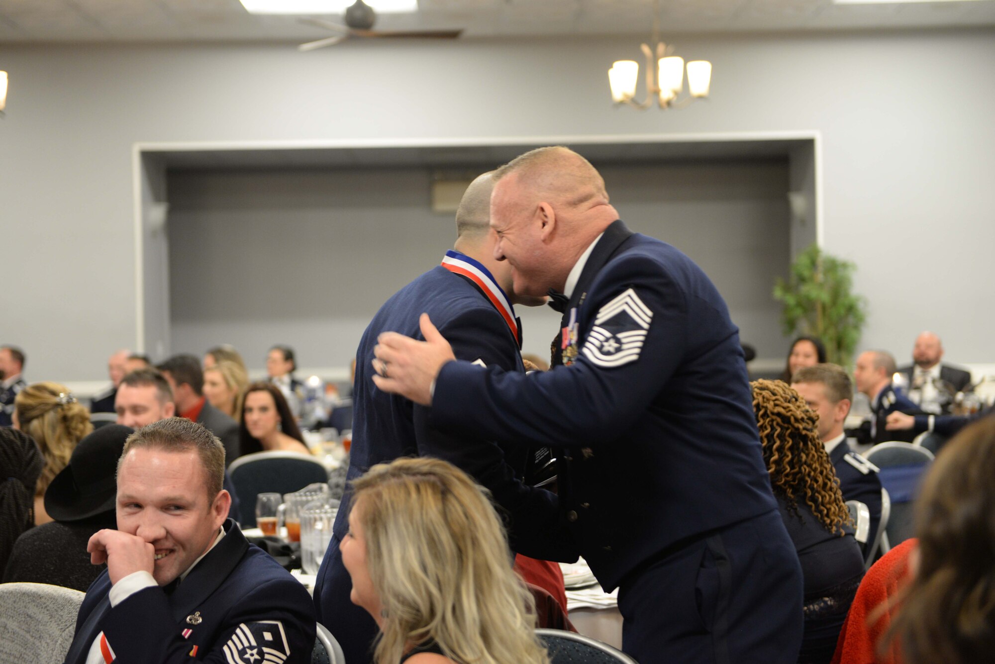 Master Sgt. Joshua Matias, 14th Operations Group control tower chief controller shakes the hand of 14th Operations Group Superintendent, Chief Master Sgt. Bradley Reilly Feb. 9, 2018, on Columbus Air Force Base, Mississippi after winning the Senior Non Commissioned Officer of the Year. Nominees were introduced at the beginning of the event, highlighting everyone’s accomplishments before the winners were announced. (U.S. Air Force photo by Airman 1st Class Keith Holcomb)