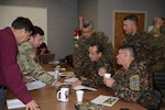 Soldiers from the Salvadoran Army participate in a break out session with representatives from U.S. Army South during day two of staff talks steering committee meetings Feb. 14.