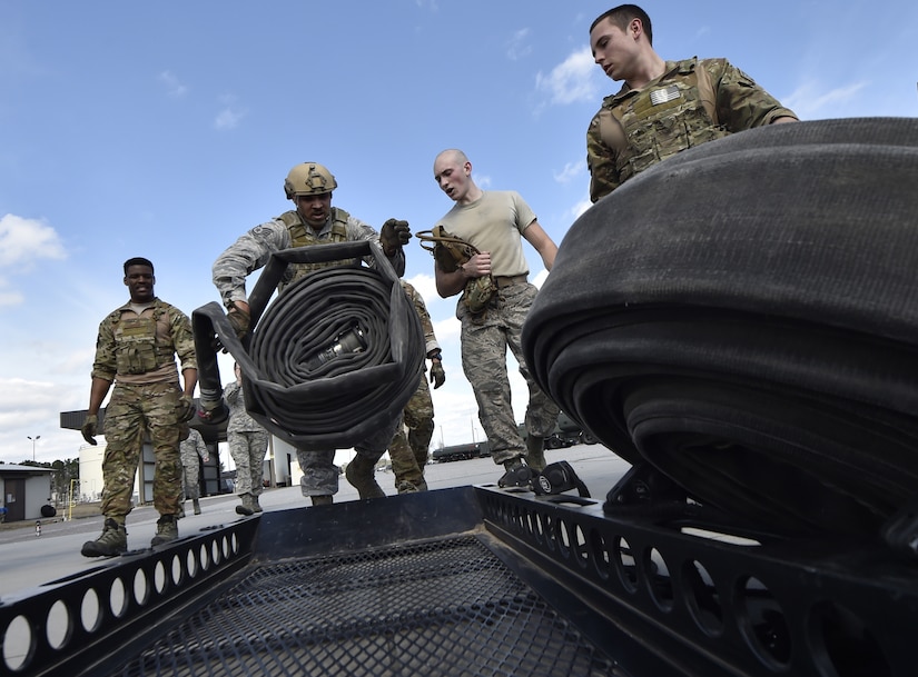 Staff Sgt. Eddie Flint, 628th Logistics Readiness Squadron fuels distribution supervisor puts away a hose during a Forward Area Refueling Point team tryout here Feb. 15, 2018.