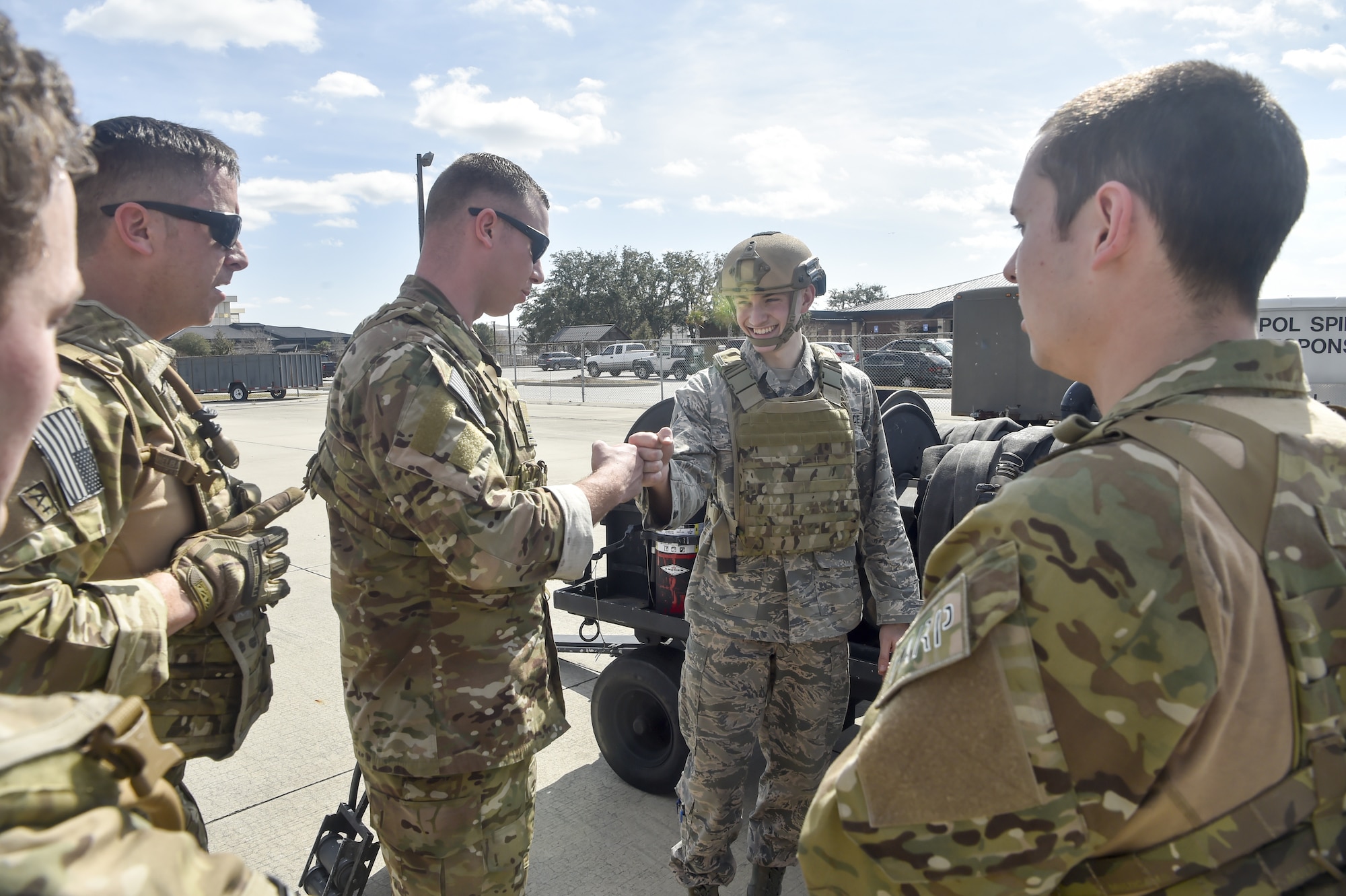 Tech. Sgt. Nicholas T. Piper, left, 628th Logistics Readiness Squadron Forward Area Refueling Point team chief offers encouragement to Airman 1st Class Nathan Lynch, 628th Logistics Readiness Squadron fuels distribution operator, prior to Lynch participating in a Forward Area Refueling Point team tryout Feb. 15, 2018.