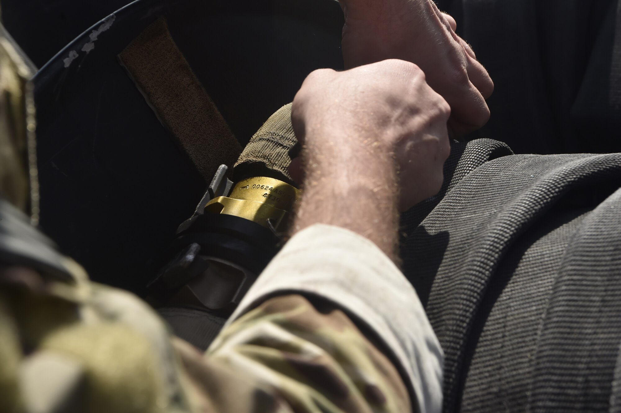 Tech. Sgt. Nicholas T. Piper, 628th Logistics Readiness Squadron Forward Area Refueling Point team chief, straps in a fuel hose prior to the start of a FARP team tryout here Feb. 15, 2018.