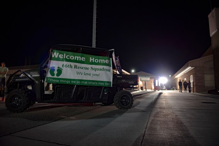 Friends and family stand by before deployed 66th Rescue Squadron and 823rd Maintenance Squadron members land Feb. 8, 2018, at Nellis Air Force Base, Nevada. The team returning home included HH-60G Pave Hawk helicopter pilots, special missions aviators, maintainers, pararescuemen, combat rescue officers, and a small support team. (U.S. Air Force photo by Airman 1st Class Andrew D. Sarver)