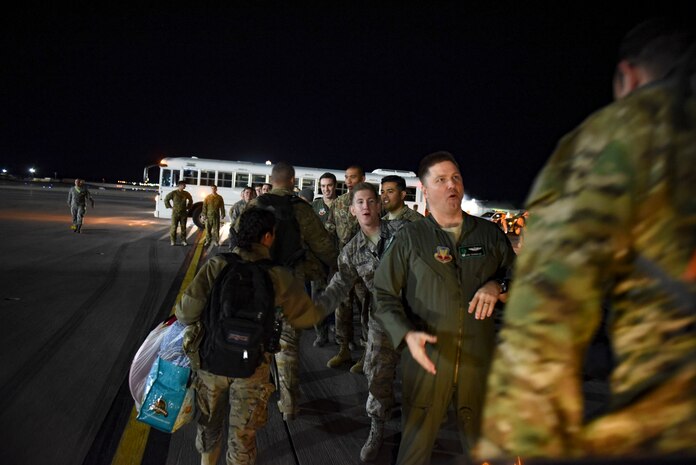 Lt Col. Joshua Shonkwiler, 66th RQS commander, greets Airmen as they exit a C-5M Super Galaxy cargo aircraft Feb. 8, 2018, at Nellis Air Force Base, Nevada. The Airmen were members of the 66th Rescue Squadron and the 823rd Maintenance Squadron. (U.S. Air Force photo by Airman 1st Class Andrew D. Sarver)