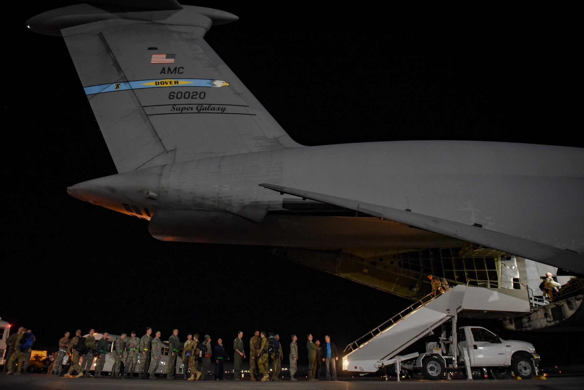 Members of the 66th Rescue Squadron and 823rd Maintenance Squadrons greet their peers as they return from deployment Feb. 8, 2018, at Nellis Air Force Base, Nevada. The Airmen spent four months overseas to support Operation Inherent Resolve with personnel recovery missions. (U.S. Air Force photo by Airman 1st Class Andrew D. Sarver)