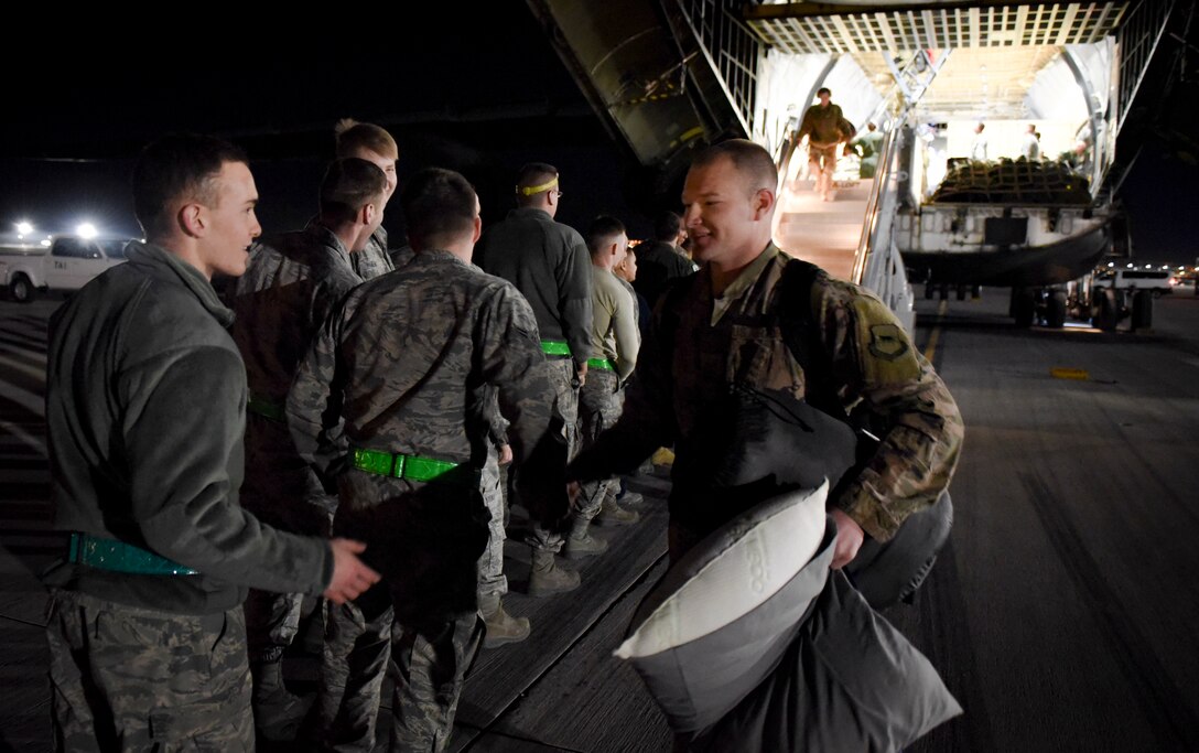An 823rd Maintenance Squadron Airman is greeted by his peers after returning from a deployment Feb. 8, 2018, at Nellis Air Force Base, Nevada. The Airmen also deployed with Guardian Angel teams from the 306th Rescue Squadron at Davis-Monthan Air Force Base, Arizona. (U.S. Air Force photo by Airman 1st Class Andrew D. Sarver)