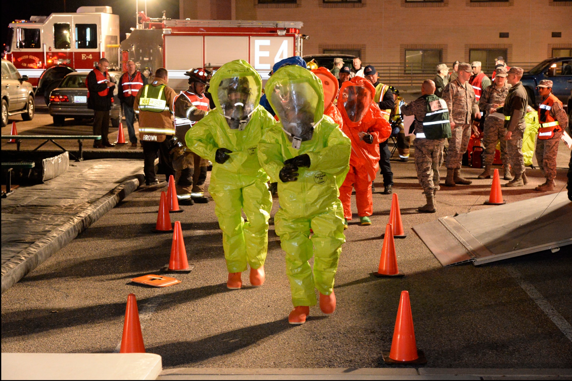Firefighter and bioenvironmental teams suit up to enter the scene during an emergency response exercise Jan. 30, 2018, at Hill Air Force Base, Utah. (U.S. Air Force photo by Todd Cromar)