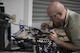 Tech Sgt. Matthew Heise, 60th Maintenance Group qualification training package instructor, sodders a pair of night vision goggles, an action that requires focus and a steady hand, Jan.19, 2017, at Travis Air Force Base, Calif. Heise is a member of the Phoenix Spark program and passionately undertakes any project that he tasks himself with. (U.S. Air Force photo by Airman 1st Class Jonathon D. A. Carnell/Released)