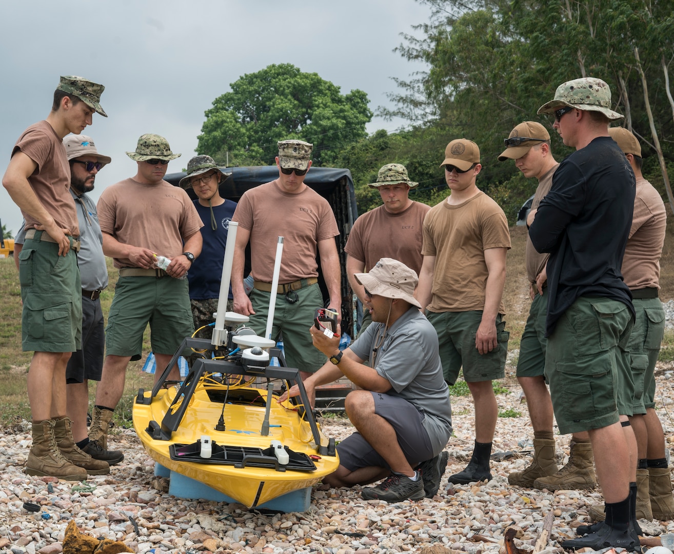 Vitad Pradith, a technical expert for Teledyne Marine, shows U.S. Navy Sailors assigned to Underwater Construction Team 2 and Republic of Korea UCT how to properly operate a Teledyne Oceanscience Z-Boat 1800 during a hydrographic survey in Sattahip, Thailand for Exercise Cobra Gold Feb. 19, 2018. Cobra Gold 18 provides a venue for the United States, allied and partner nations to advance interoperability and increase partner capacity in planning and executing complex and realistic multinational force and combined task force operations.