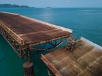 U.S. Navy Sailors assigned to Underwater Construction Team 2 stand on the De Long Pier in Sattahip, Kingdom of Thailand during Exercise Cobra Gold Feb. 20, 2018. Cobra Gold 18 provides a venue for the United States, allied and partner nations to advance interoperability and increase partner capacity in planning and executing complex and realistic multinational force and combined task force operations.