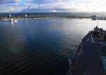 The Arleigh Burke-class guided-missile destroyer USS Sterett (DDG 104) renders honors as it passes the USS Arizona Memorial while arriving in Pearl Harbor for a port visit. Sterett is on a scheduled deployment to conduct operations in the Indo-Pacific region. It will also support the Wasp Expeditionary Strike Group (ESG) in order to advance U.S. Pacific Fleet’s Up-Gunned ESG concept and will train with forward-deployed amphibious ships across all mission areas.