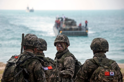 Republic of Korea Marines await the arrival of a ROK landing craft utility on Hat Yao Beach, Rayong province, Thailand during Exercise Cobra Gold 2018, Feb. 17, 2018. CG18 provides a venue for the United States, allied and partner nations to advance interoperability and increase partner capacity in planning and executing complex and realistic multinational force and combined task force operations. CG18 is an annual exercise conducted in the Kingdom of Thailand held from Feb. 13-23 with seven full participating nations.