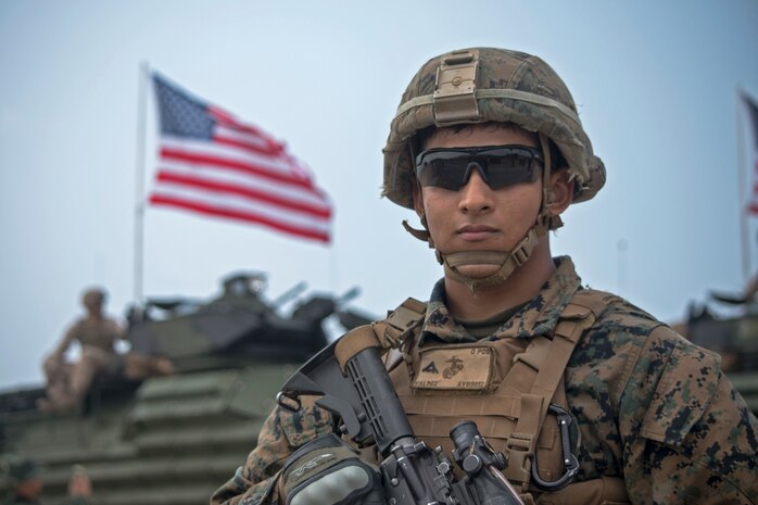 U.S. Marine Lance Cpl. Allen Valdez, from Inglewood, Calif., poses for a photo on Hat Yao Beach, Rayong province, Thailand during Exercise Cobra Gold 2018, Feb. 17, 2018. CG18 provides a venue for the United States, allied and partner nations to advance interoperability and increase partner capacity in planning and executing complex and realistic multinational force and combined task force operations. CG18 is an annual exercise conducted in the Kingdom of Thailand held from Feb. 13-23 with seven full participating nations.