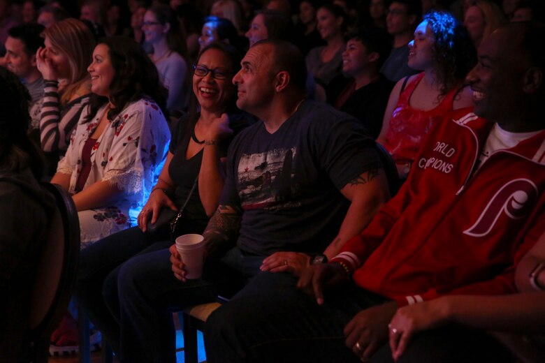 Audience members laugh during Adam DeVine’s comedy show Feb. 10 at the Surfside Ballroom aboard Camp Kinser, Okinawa, Japan. DeVine traveled to U.S. military bases across the globe performing for service members unable to be home for the holidays. DeVine is an actor, comedian, singer and producer known for his roles in “Pitch Perfect” and “Workaholics.” (U.S. Marine Corps photo by Pfc. Nicole Rogge)