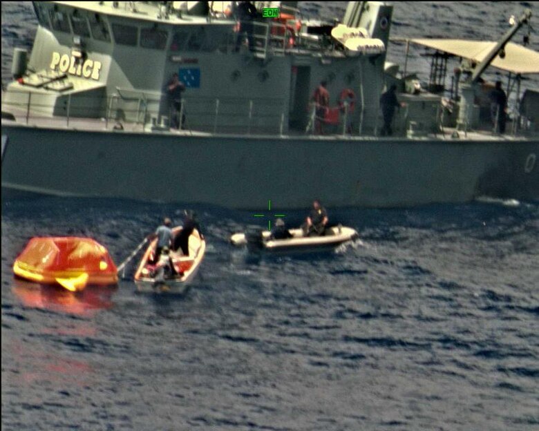 CHUUK ATOLL, Federated States of Micronesia (Feb. 20, 2018) Mariners maneuver a UNI-PAC II Search and Rescue (SAR) kit closer to their vessel. The SAR kit was deployed from a P8-A Poseidon aircraft assigned to the "Fighting Tigers" of VP-8, and its use during the rescue of three fishermen in the South Pacific marked the first time it had successfully been deployed in a real world SAR operation.